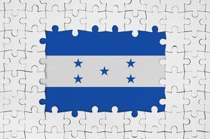 Honduras flag in frame of white puzzle pieces with missing central part photo