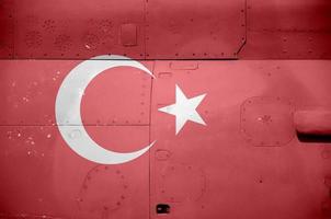 Turkey flag depicted on side part of military armored helicopter closeup. Army forces aircraft conceptual background photo