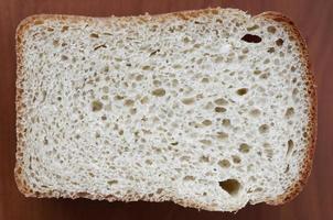 White bread texture in a cut. Close-up view on the plane of the finished dough product photo
