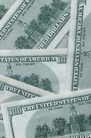 Abstract backdrop with many hundred dollar bills close up photo