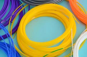 Plastic PLA and ABS filament material for printing on a 3D pen or printer of various colors photo