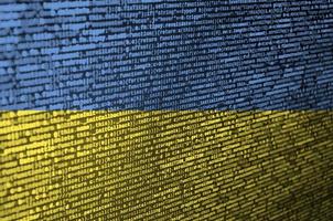 Ukraine flag  is depicted on the screen with the program code. The concept of modern technology and site development photo