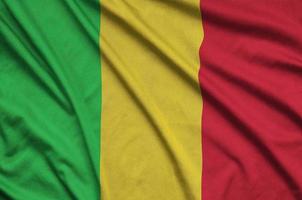 Mali flag  is depicted on a sports cloth fabric with many folds. Sport team banner photo