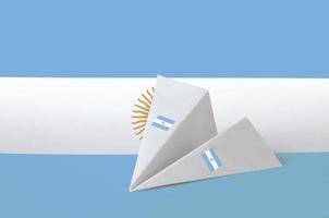 Argentina flag depicted on paper origami airplane. Handmade arts concept photo