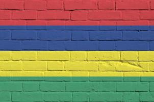 Mauritius flag depicted in paint colors on old brick wall. Textured banner on big brick wall masonry background photo