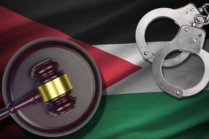 Jordan flag with judge mallet and handcuffs in dark room. Concept of criminal and punishment, background for judgement topics photo