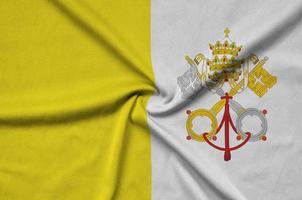 Vatican City State flag  is depicted on a sports cloth fabric with many folds. Sport team banner photo