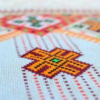 Traditional Ukrainian folk art knitted embroidery pattern on textile fabric photo