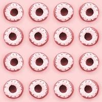 Many small plastic donuts lies on a pastel colorful background. Flat lay minimal pattern. Top view photo