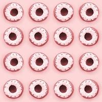 Many small plastic donuts lies on a pastel colorful background. Flat lay minimal pattern. Top view photo