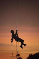 Rescue on a rope in the sunset photo