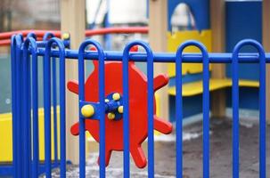 A fragment of modern bright colorful swings on the Playground. An ideal place for children's outdoor activities. photo