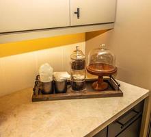 Kitchen Counter Top With Wooden Tray Of Breakfast Items photo