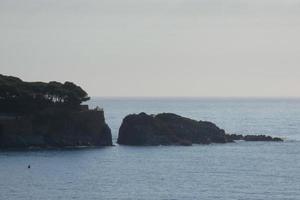 Mediterranean coastline with rocks in the catalan region, Spain photo