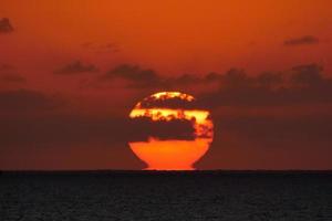 Sun disk rising over the horizon of the sea, sunrise, dawn photo