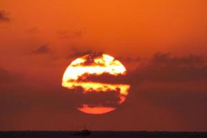 Sun disk rising over the horizon of the sea, sunrise, dawn photo