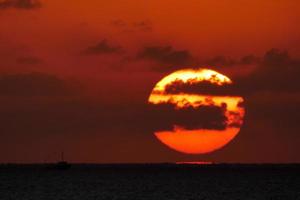 Sun disk rising over the horizon of the sea, sunrise, dawn photo