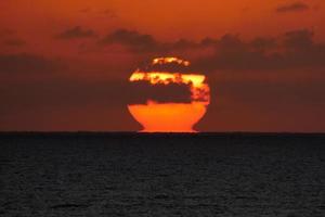 Sun disk rising over the horizon of the sea, sunrise, dawn photo