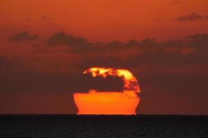 Sun disk rising over the horizon of the sea, sunrise, dawn photo