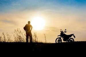 man with motocross beautiful light mountain independent adventure tourism concept photo