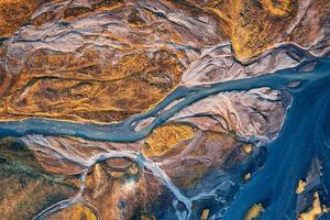 Abstract glacier rivers pattern flowing through volcanic lava field in Icelandic highlands photo