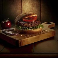 Delicious homemade steakburger on an old wooden table. Fat unhealthy food close-up. photo