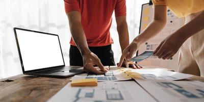 Graphic designers creative drawing website ux app development and application for mobile phone in the office. photo