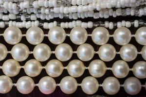 Pearl beads background with many shiny pearls photo