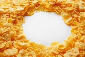 Golden Cornflakes full frame with empty round copy space in the middle as viewed from above photo