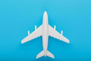 Passenger Model airplane on a blue background. Free space for text. photo