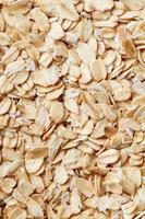 Golden cereal muesli, background and texture. Oatmeal grains. Healthy breakfast Top view. Close-up photo
