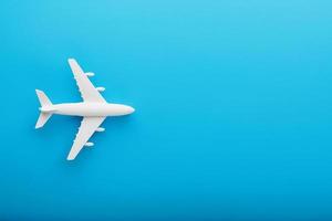 Passenger Model airplane on a blue background. Free space for text. photo