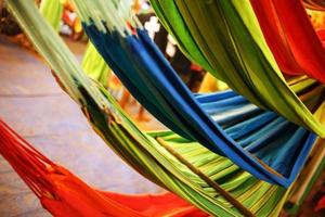 Hammocks of different colors, colors of the rainbow on the night market in Goa photo