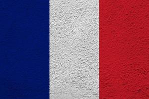 bandera de francia sobre un fondo texturizado. collage de conceptos foto