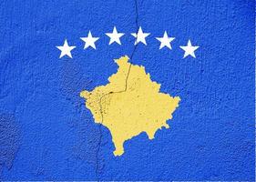 Flag of Kosovo on a textured background. Concept collage. photo