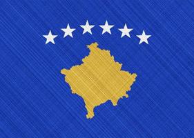 bandera de kosovo sobre un fondo texturizado. collage de conceptos foto