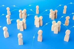 Groups of people and persons connected by lines form a social network. Communication, interaction and involvement of specialists. Contacting, communicate exchange of information. Relationship concept photo