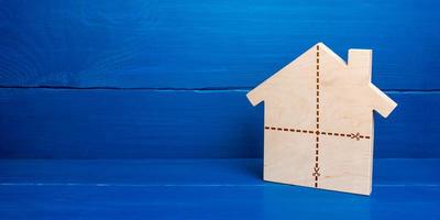 House with marked cut lines. Fair division of property ownership in case of divorce or inheritance. Resolving ownership conflicts. Exchange real estate for several separate ones. Splitting home photo
