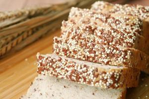 detail shot of whole grain baked bread on table photo