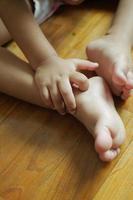 child girl suffering from itching skin, close up. photo