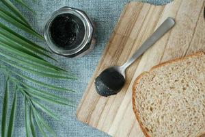 Black sesame spread on a bread photo