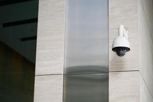 CCTV security camera operating outdoor photo