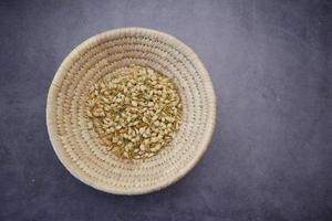 top view of jasmine dry flower in a container on table photo