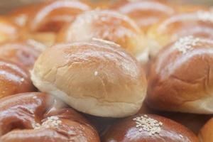 close up of stack of baked bread on table photo