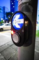 close up of crossing signal button in singapore photo