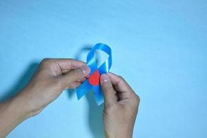 Blue ribbons on blue background with the word world diabetes day, November Men health awareness, November Blue. diabetes awareness photo