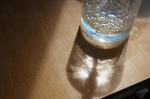 Closeup Liquid soap on wooden table photo