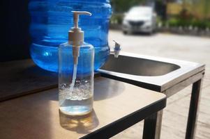 Closeup Liquid soap on wooden table photo