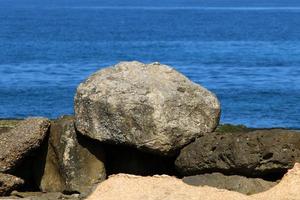 The stones lie on the shores of the Mediterranean Sea. photo