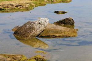 The stones lie on the shores of the Mediterranean Sea. photo